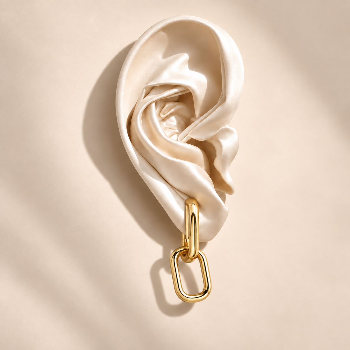 Lyra Gold Link Drops on an ivory satin ear