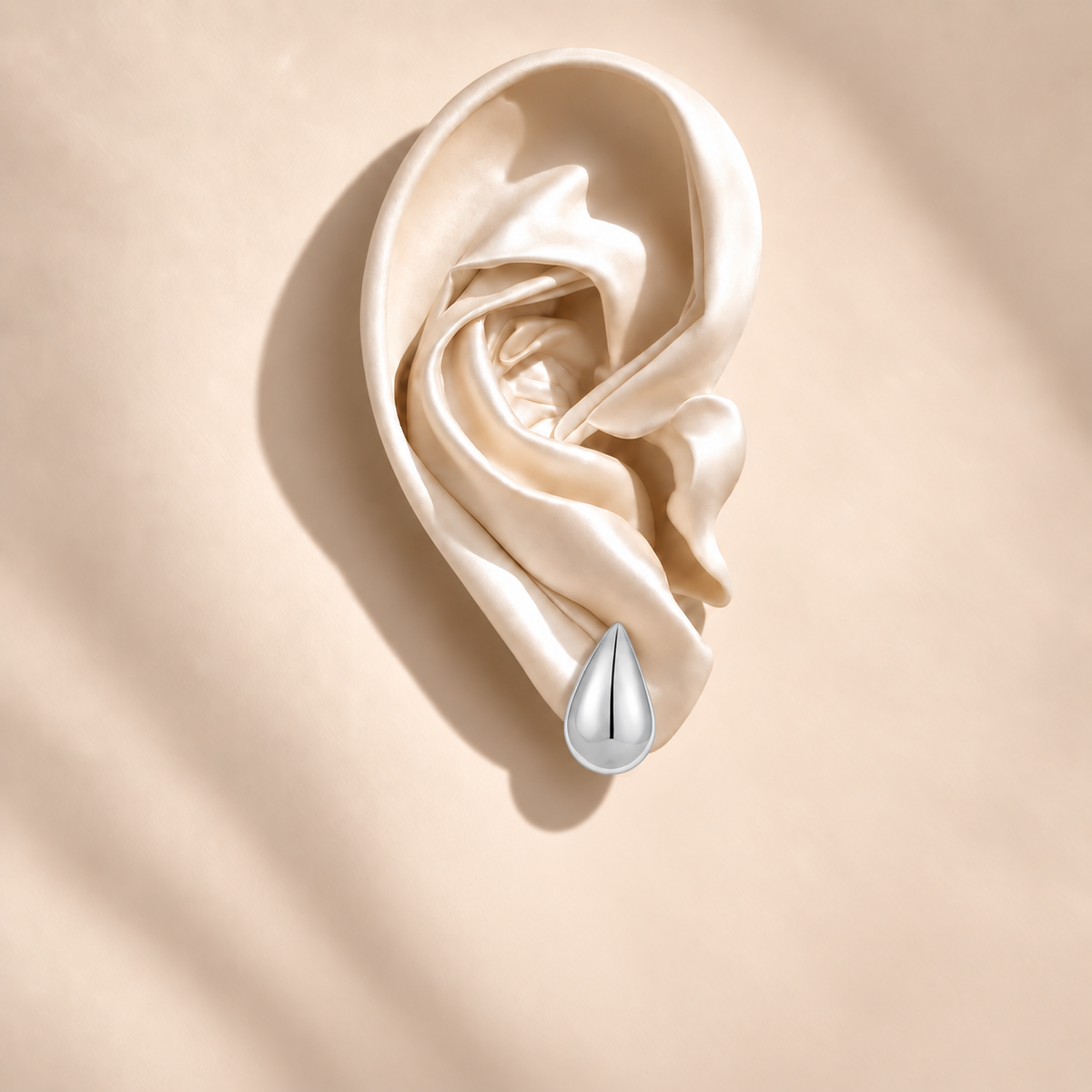 Solène Silver Teardrop Studs — ivory satin ear