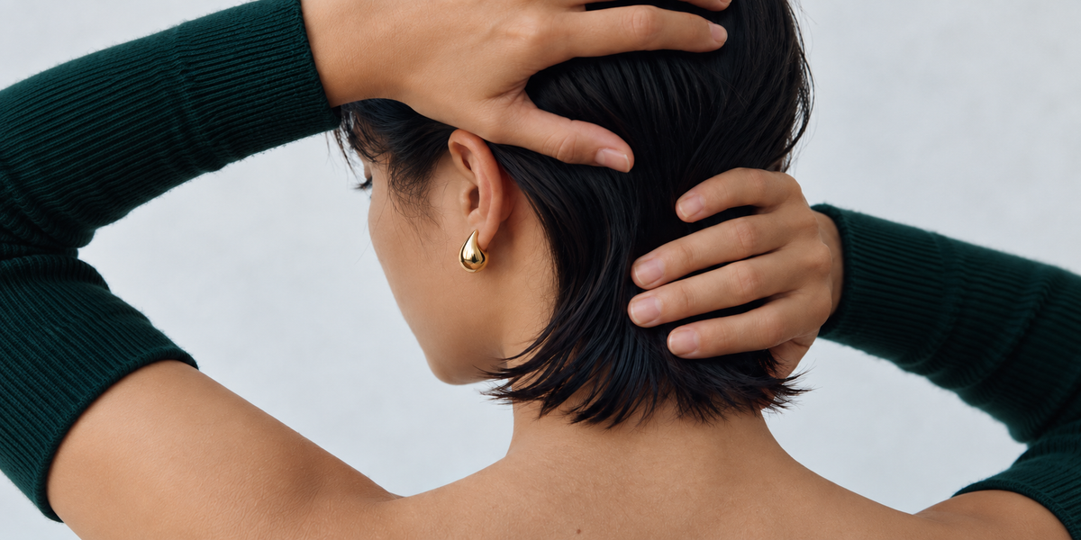 Zarrii gold edit earrings with emerald styling