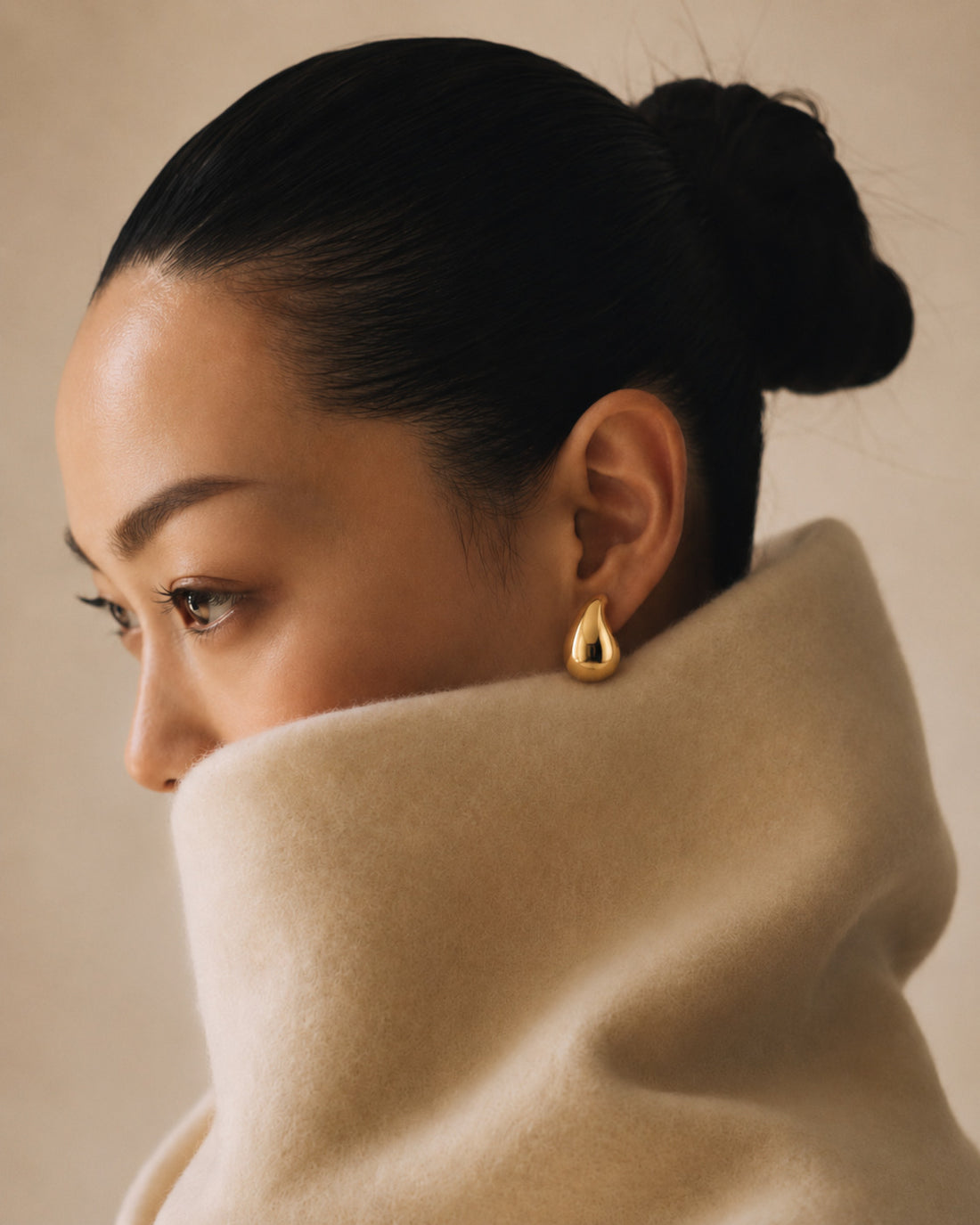 Gold Edit editorial cover featuring gold teardrop earrings