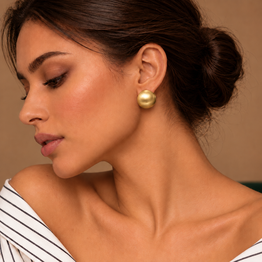 Luna Gold Dome Studs worn by a model in an ivory striped shirt