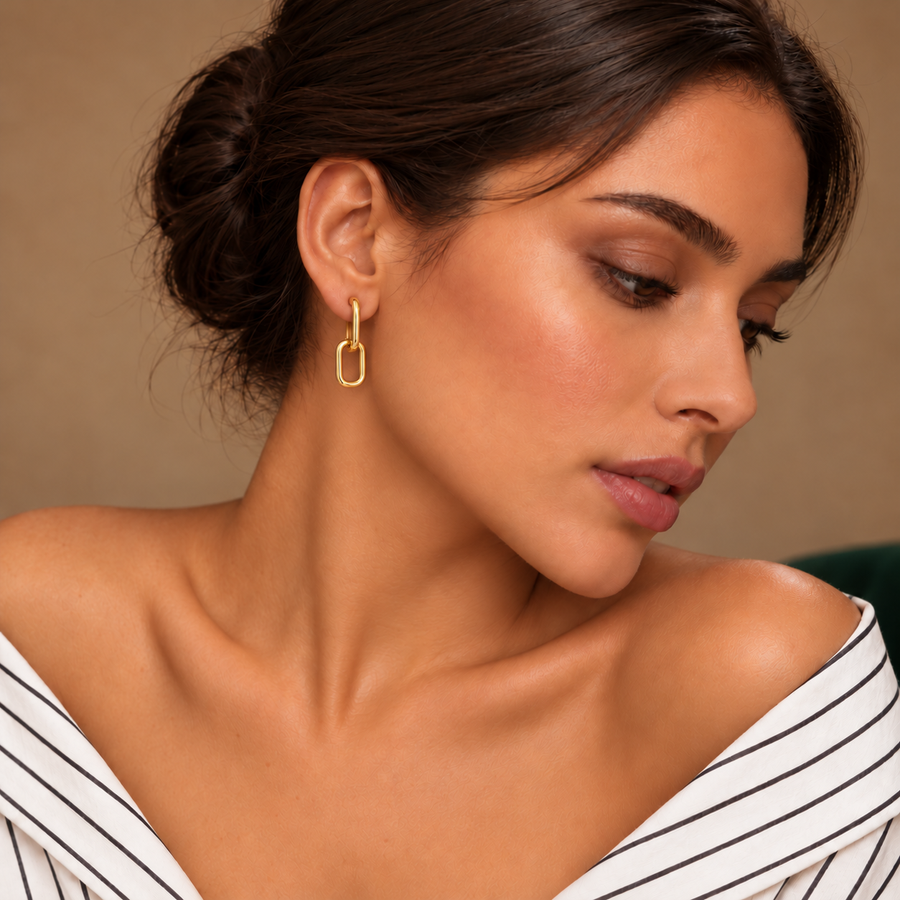 Lyra Gold Link Drops worn with an ivory striped shirt in a warm neutral studio