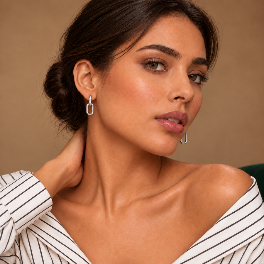 Lyra Silver Link Drops worn with an ivory striped shirt in a warm neutral studio